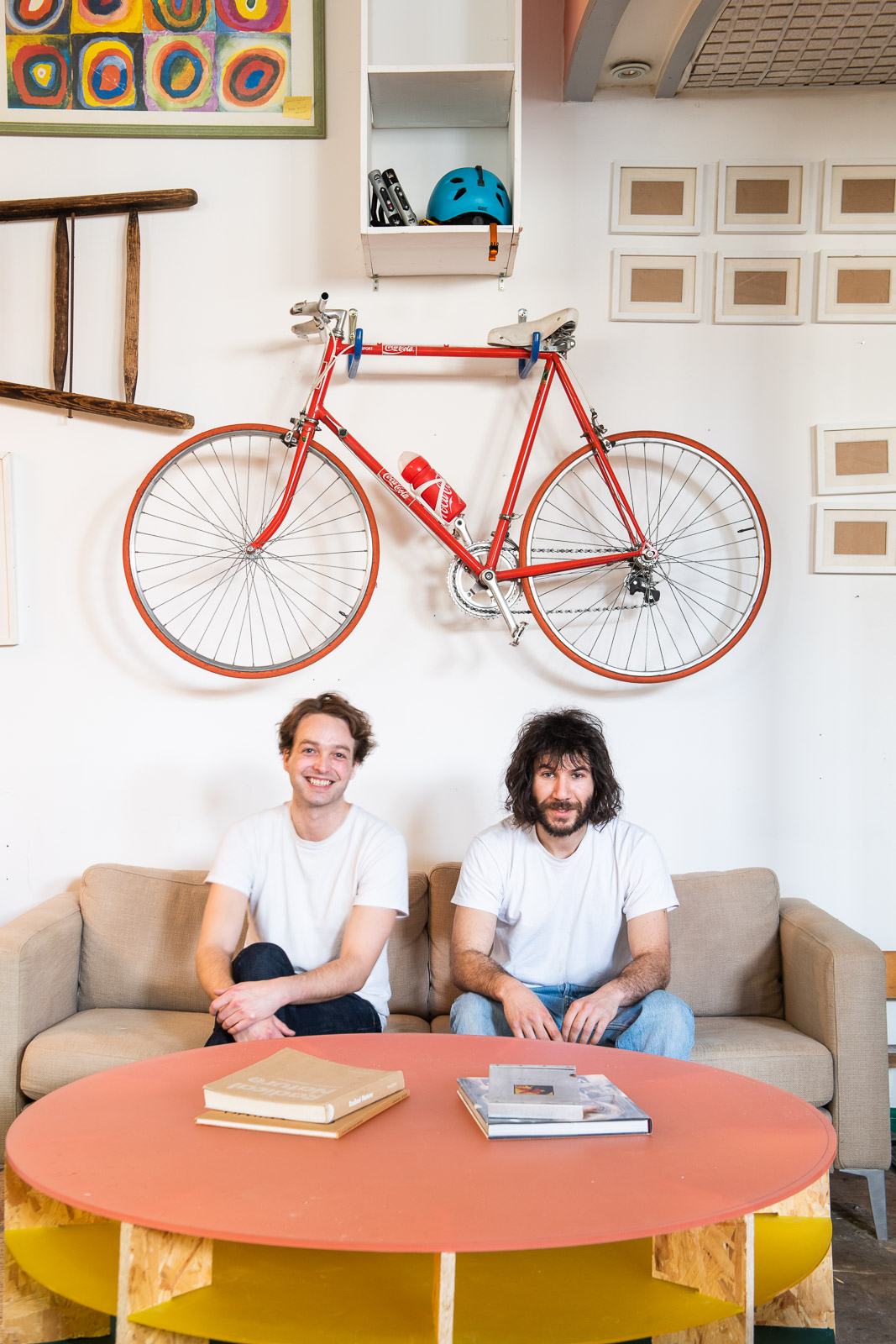 Inside Highbury and Islington property - 2 men sitting on sofa after redesign