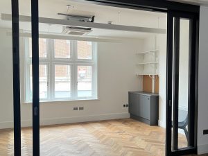 glass doors in a room with a wooden floor