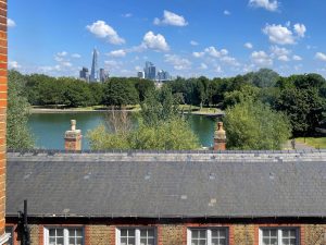 view of city of london over a park and lake