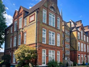 brown and red brick four-story buidling